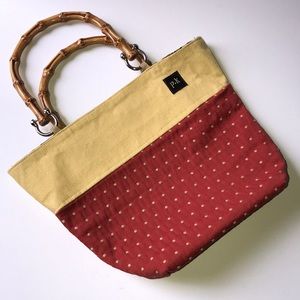 Adorable p.k wooden handle purse. Never used.